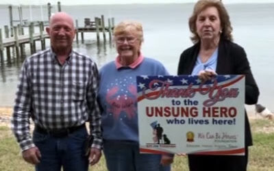 Jeannie and Doug Ping Receive Unsung Hero Lives Here Yard Sign